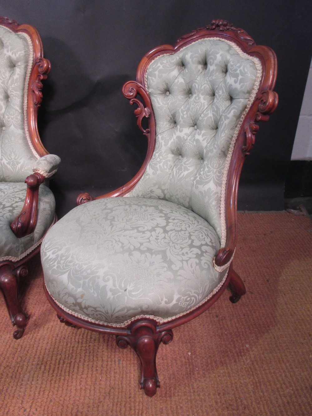 A Victorian walnut framed drawing room chair, a similar armchair and a