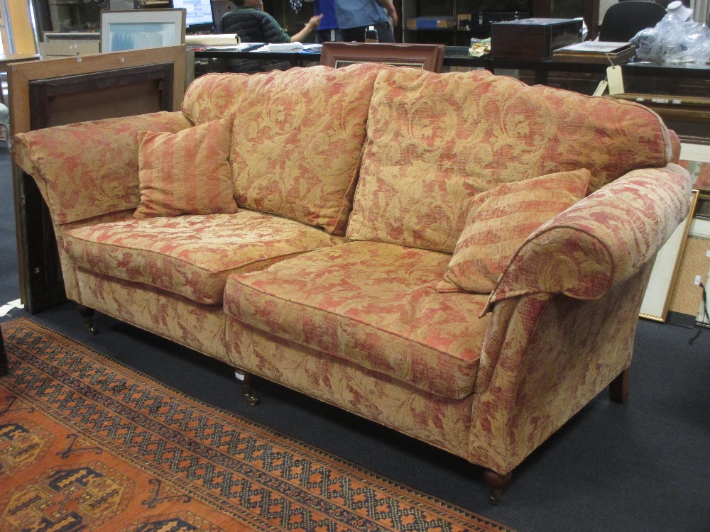 A pair of Duresta two seater sofas with loose seat cushions and on