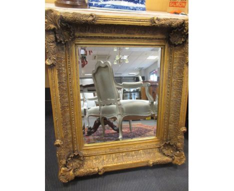 A gilt framed wall mirror with a bevelled plate, 88 x 78cm  