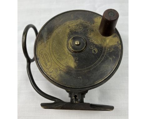 A vintage brass Mallochs fishing reel, marked and inscribed. D.10 reel W.4.5cm 