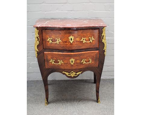 A Louis XV style commode with serpentine marble top, over a bombe gilt metal mounted floral marquetry inlaid kingwood two dra