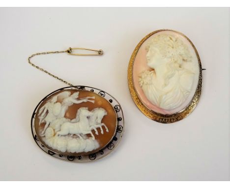 A gold mounted oval shell cameo brooch, carved as a classical chariot scene above clouds, the mount decorated with bead and w