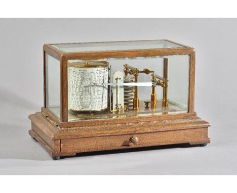 AN EDWARDIAN OAK CASED BAROGRAPHBy Negretti and Zambra, London, No. 30390, circa 1900The case with five bevelled glazed panel