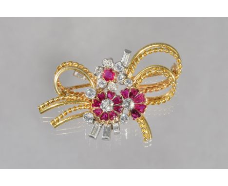A gold ruby and diamond brooch, designed as a floral and ropetwist wirework spray, mounted with variously cut rubies and circ