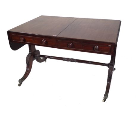 A Regency mahogany sofa table, with two drawers on dual standard supports, 113cm wide x 76cm deep x 71cm high. Provenance; pr