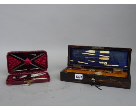 A Coromandel rectangular sewing box with hinged lid and fitted interior, 28cm wide and a mother-of-pearl dressing set in a ve