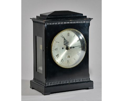 A REGENCY EBONISED BRACKET CLOCKBy Cumming, LondonThe case with a chamfered top above a stepped pediment, with brass bezel an