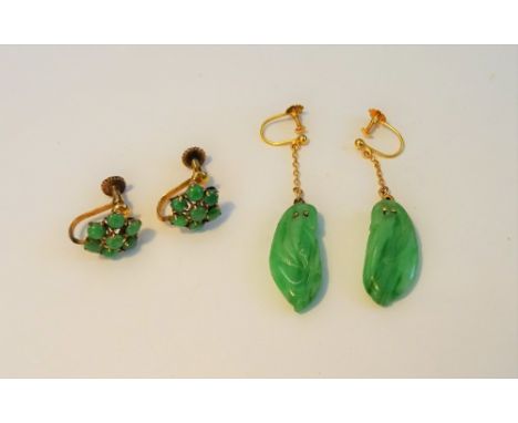 A pair of gold and green bead cluster earings, the screw fittings detailed 14ct and a pair of gold and carved jade pendant ea