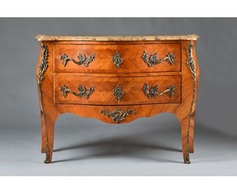 A Louis XV style commode, the marble top over a gilt metal mounted walnut bombe two drawer base, on slender cabriole supports