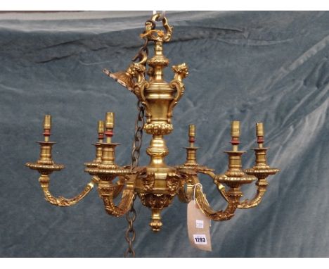 A French ormolu six light chandelier after the model by Andre Charles Boulle, the urn body embellished with female masks issu