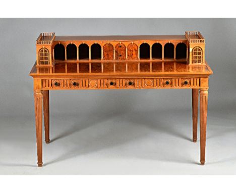 David Linley; a walnut and mahogany writing table of architectural Carlton House form, with marquetry decorated galleried top