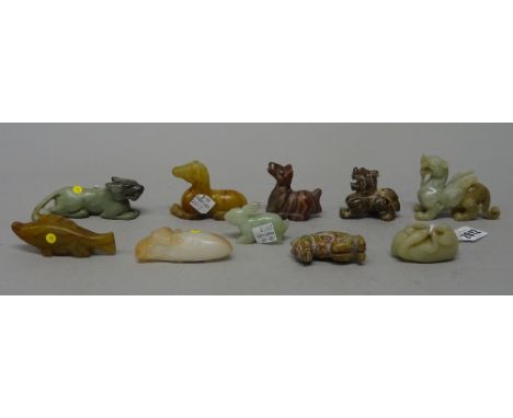 A group of ten Chinese archaistic figures of animals, nine of jade, the other in agate, largest 6cm. high, (10).