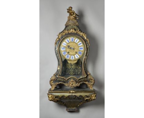 A FRENCH ORMOLU-MOUNTED TORTOISESHELL AND CUT BRASS INLAID 'BOULLE' BRACKET CLOCK AND BRACKETIn the Louis XV styleThe pedimen