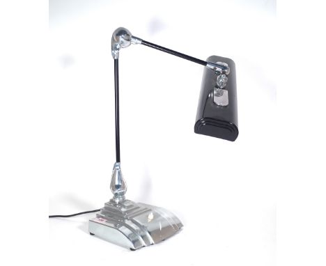 Flexo; a 20th century Art Deco style anglepoise desk lamp with polished steel base, approximately 58cm high. Provenance; prop