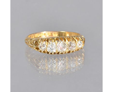 An 18ct gold and diamond set five stone ring, mounted with a row of cushion shaped idamonds, graduating in size to the centre