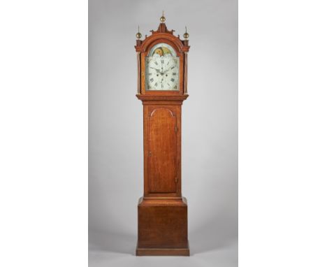 A GEORGE III OAK LONGCASE CLOCKBy John Payne, Lenham, circa 1780The case with an arched pediment and fretted cornice, above a