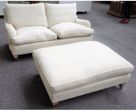 DURESTA; a two seat sofa in cream upholstery, 171cm wide x 77cm high, together with matching footstool 122cm wide, (2).