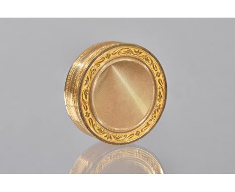 A French gold box and cover, of circular form, with engine turned decoration to the centre of the lid and to the base, within