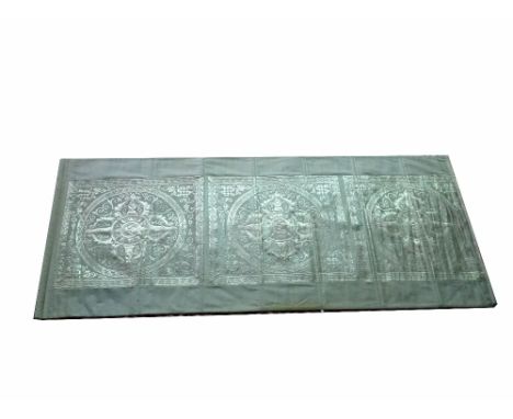 A modern Asian silkworm hanging tapestry, of rectangular form with three mandala woven designs in silver coloured thread, 226