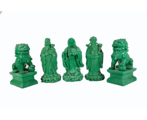 A group of modern faux spinach jade figures, comprising; a pair of dogs of fo and thee immortals, the largest 20cm high. Prov