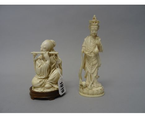 A Japanese ivory okimono of a musician, Meiji/ Taisho period, carved as a seated young woman playing the flute, 11.5cm. high,