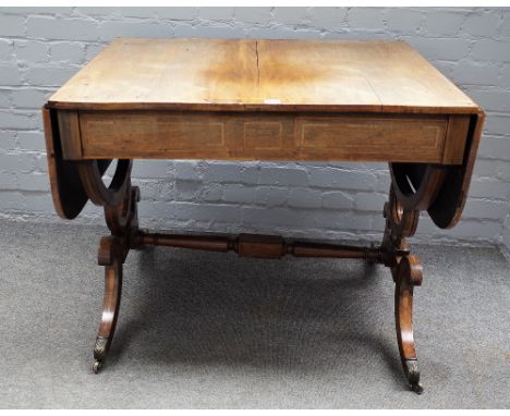 A Regency inlaid rosewood sofa table with a pair of frieze drawers on four downswept supports, united by turned stretcher, 88