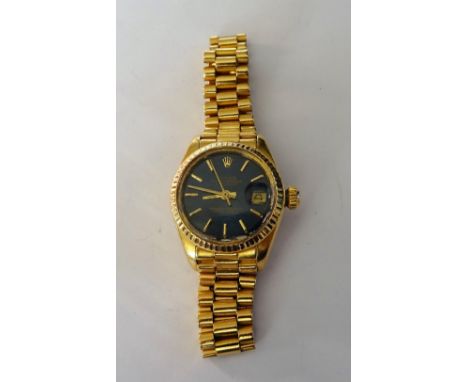 A Rolex Oyster Perpetual Datejust lady's 18ct gold bracelet wristwatch, the signed blue dial with gilt baton numerals, gilt h