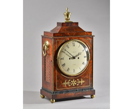 A REGENCY BRASS-INLAID MAHOGANY BRACKET CLOCKBy Horatio Smith, York, circa 1825The chamfer-top case surmounted by a vase poma