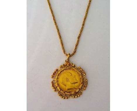 An Edward VII sovereign 1907, in a gold pendant mount, of Middle Eastern design, with a Middle Eastern gold multiple link nec