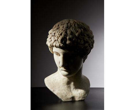 After the Antique; a carved white marble portrait bust of a man, drill carved hair, recessed eyeballs, unsigned, 42cms high. 