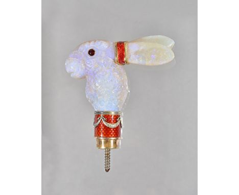 A carved opal and red enamelled parasol handle, designed as the head of a hare, with red gem set eyes and gilt mounts, having