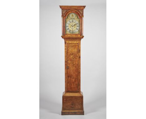 A GEORGE I WALNUT LONGCASE CLOCKBy James Drury, London, circa 1720The case with a moulded pediment above fretted spandrels an