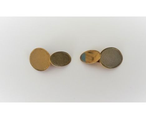 A pair of 9ct gold cufflinks, the larger oval fronts with engine turned decoration, the smaller oval backs undecorated, Birmi