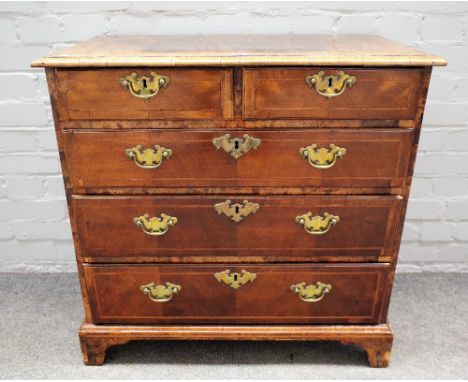 A mid-18th century and later inlaid figured walnut chest with two short and three long graduated drawers on bracket feet, 78c