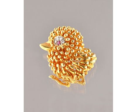 A Kutchinsky 18ct gold, ruby and diamond brooch, designed as a chick, the eye mounted with a circular cut ruby and with four 
