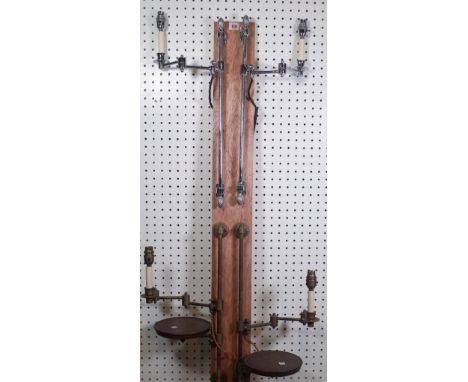 A pair of modern chromed single branch wall lights with pineapple finials to the adjustable backplate and anglepoise arms, 48