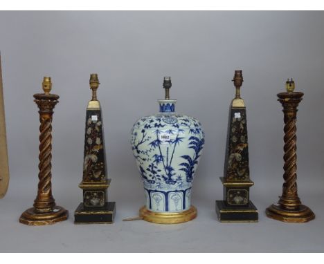 A modern Chinese blue and white porcelain table lamp of baluster form, 38cm high, a pair of wooden obelisk form table lamps w