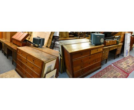 A group of furniture including two early 20th century oak desks, a pair of early 20th century oak four height chests of drawe