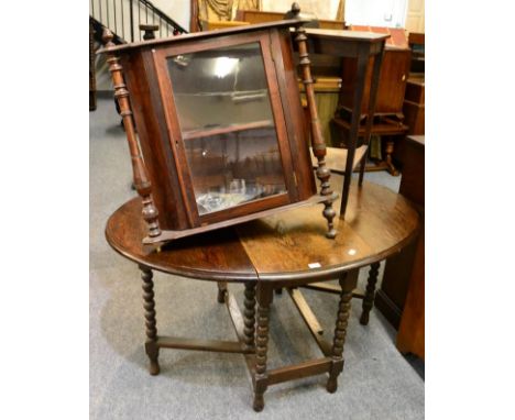 An oak dropleaf dining table on bobbin turned legs; a late Victorian rosewood corner table raised on square tapering legs and