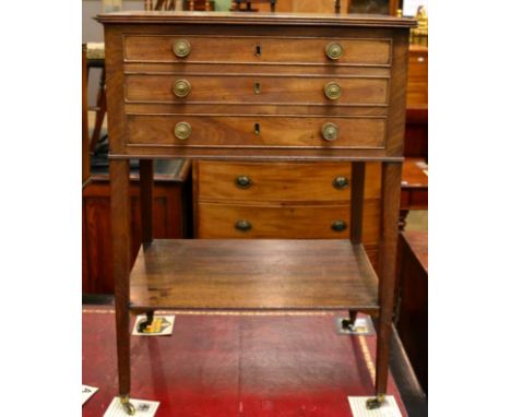 A 19th century mahogany side table with drop leaf writing surface, twin candle slides, small side drawer fitted with an inkwe