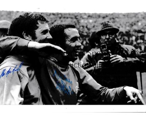 RANGERS / AUTOGRAPHS A 12 X 8 photo of Willie Henderson and Alex MacDonald arm in arm as they celebrate a memorable 1-0 victo