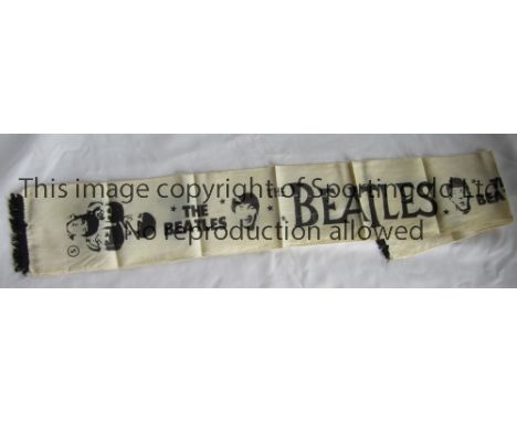 BEATLES MEMORABILIA Beatles Scarf (42" x 5.5") Circa 1964. A large "The Beatles" and various images of The Beatles features o