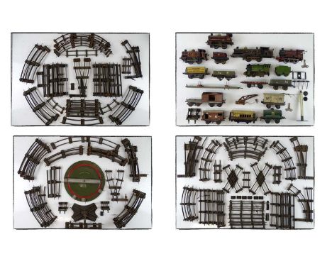 A large quantity of O gauge clockwork rolling stock, track and accessories to include various locos and wagons by HORNBY and 