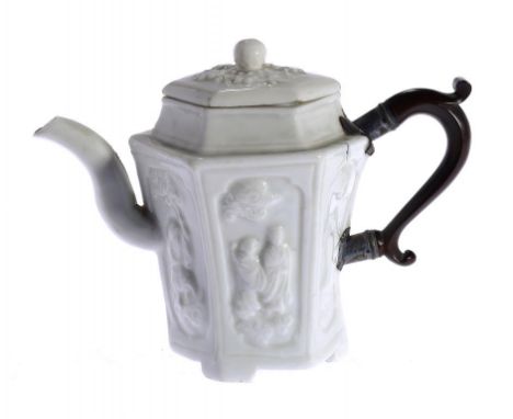 A CHINESE DEHUA BLANC DE CHINE HEXAGONAL WINE POT AND COVER, KANGXI, WITH 18TH CENTURY REPLACEMENT HANDLE the sides moulded w