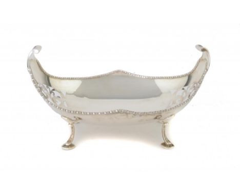 A GEORGE V SAW PIERCED SILVER CANOE SHAPED FRUIT BOWL  29cm w, by C W Fletche & sON lTD r, Sheffield 1930, 23ozs ++In fine co