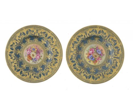 A PAIR OF ROYAL WORCESTER PLATES, 1938 AND 39 painted by J Freeman or E Barker, both signed, with flowers reserved on a powde