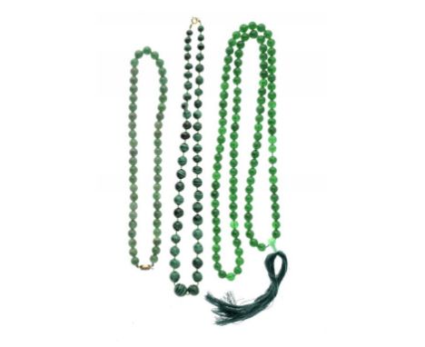 TWO NECKLACES OF JADE BEADS one with silver gilt filigree clasp and a  malachite bead necklace,,  various sizes (3) ++All in 