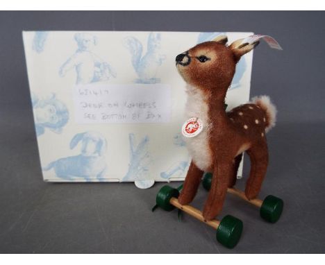 Steiff - A boxed, limited edition Steiff # 681417 'Fawn On Wheels ornament', white tag, approximately 13 cm (h)