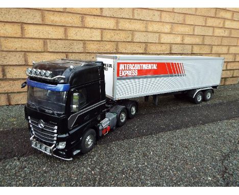 Tamiya - a built Tamiya 1:14 scale RC Mercedes-Benz Actros 3363 6x4 3 axle truck and Intercontinental Express Trailer. A high