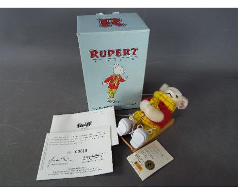 Steiff - A boxed limited edition Steiff Rupert The Bear ornament # 653537, white tag, approximately 12 cm.The box has slightl